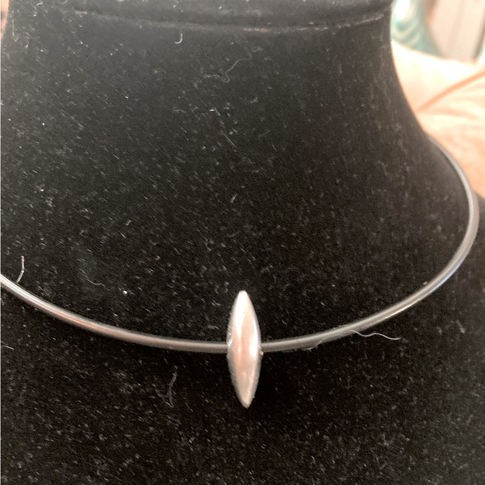 Silver bead on hard plastic cord necklace, 16”